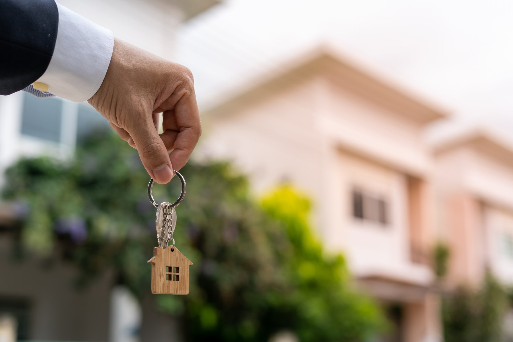 Home buyers are taking home keys from sellers. Deal contract